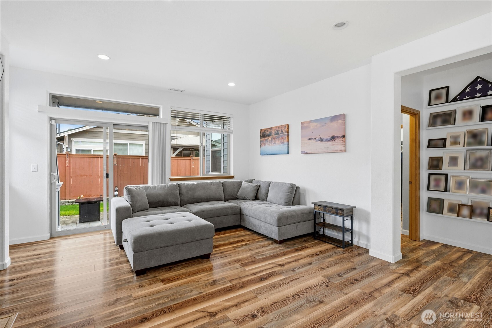 8218 Bainbridge Loop Northeast Lacey, WA 98516 - Photo 16 of 40 a living room with furniture and a wooden floor