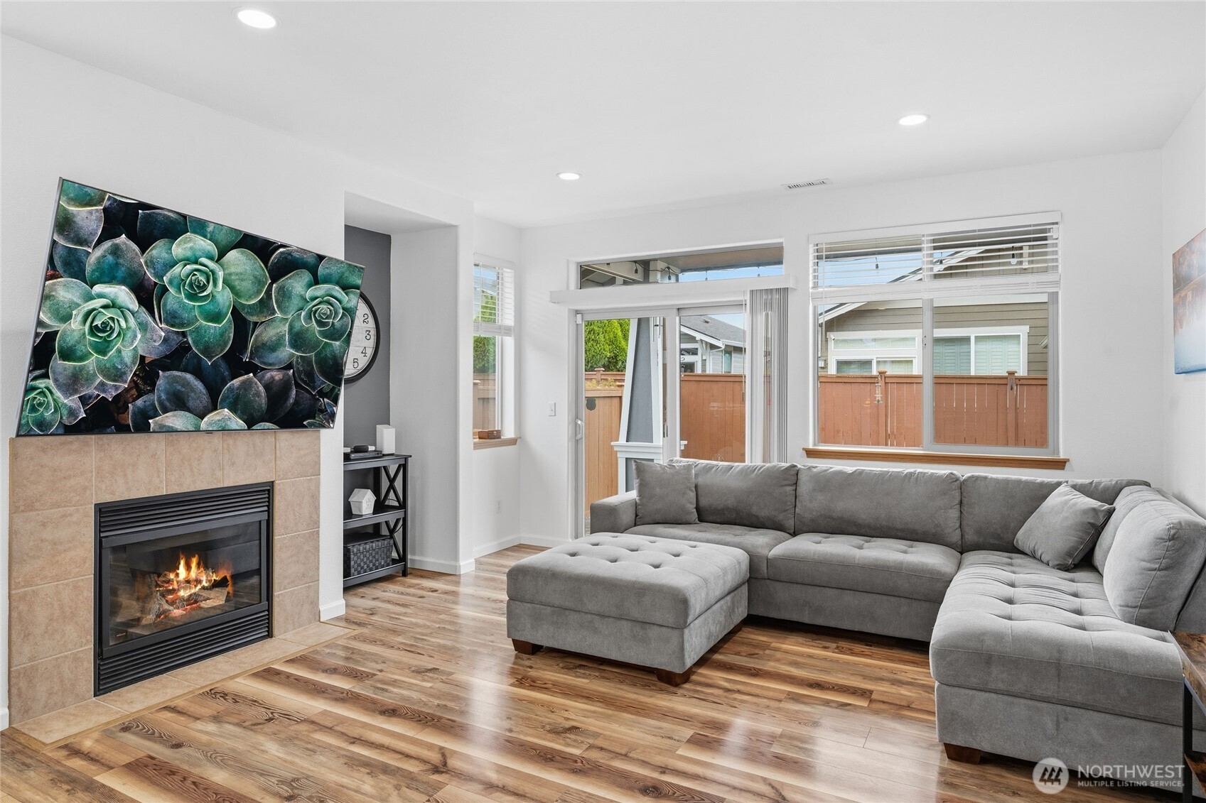 8218 Bainbridge Loop Northeast Lacey, WA 98516 - Photo 18 of 40 a living room with furniture a window and a fireplace