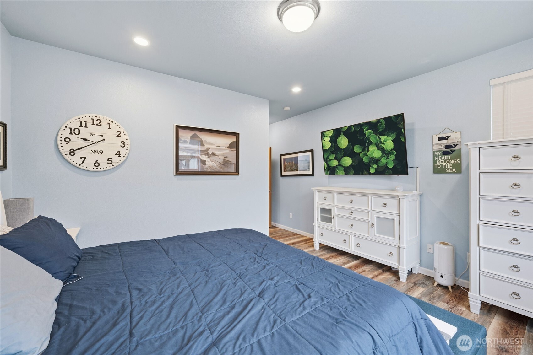 8218 Bainbridge Loop Northeast Lacey, WA 98516 - Photo 25 of 40 a view of a bedroom with cabinet with flat screen tv