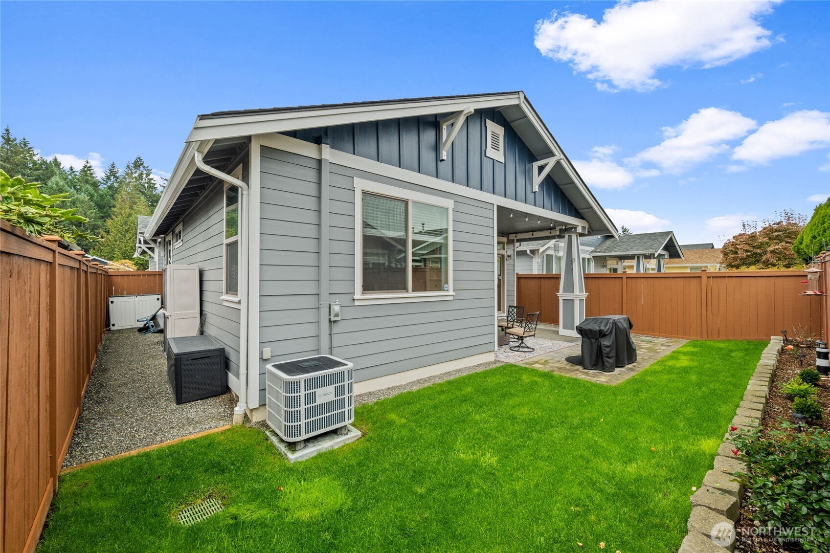 8218 Bainbridge Loop Northeast Lacey, WA 98516 - Photo 29 of 40 a front view of a house with garden and yard
