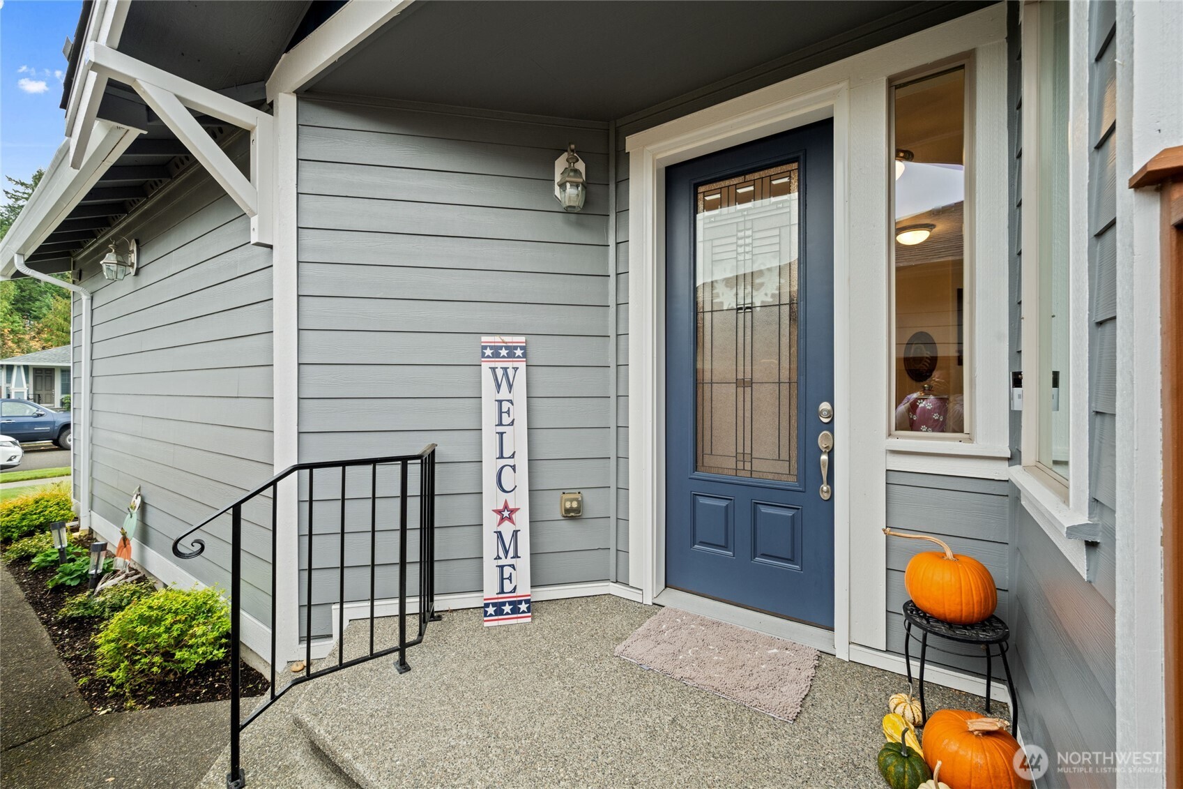 8218 Bainbridge Loop Northeast Lacey, WA 98516 - Photo 3 of 40 a view of a porch with a door and wooden floor