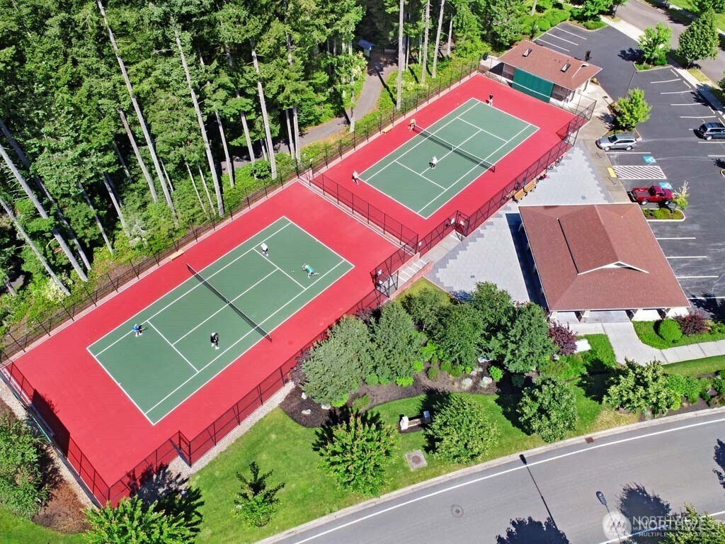 8218 Bainbridge Loop Northeast Lacey, WA 98516 - Photo 38 of 40 an aerial view of a tennis ground with a street
