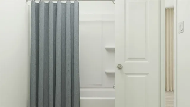 a bathroom with bathtub and shower