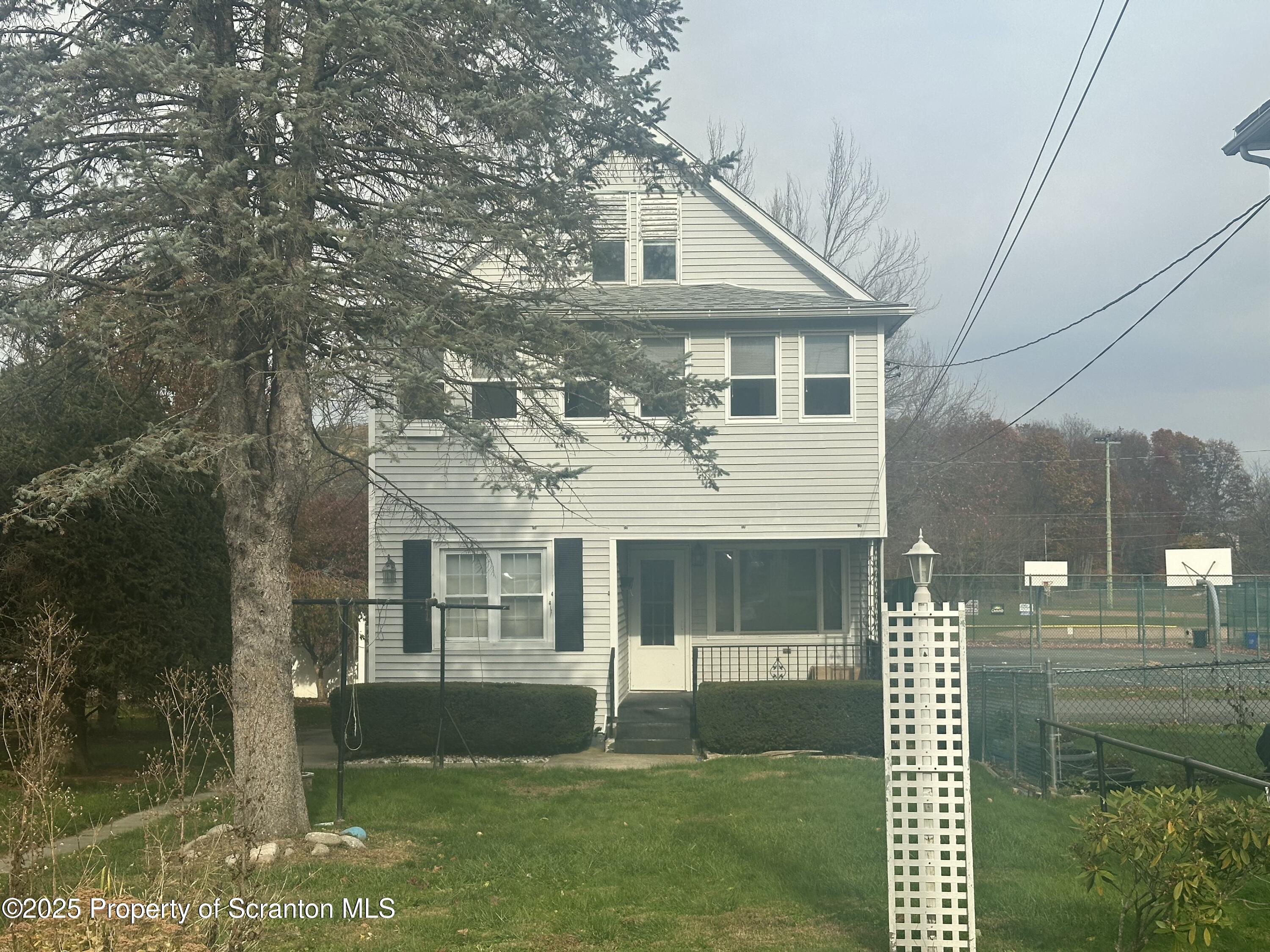 1906 Farr Street, Unit 2 Scranton, PA 18504 - Photo 1 of 14 a front view of a house with a yard