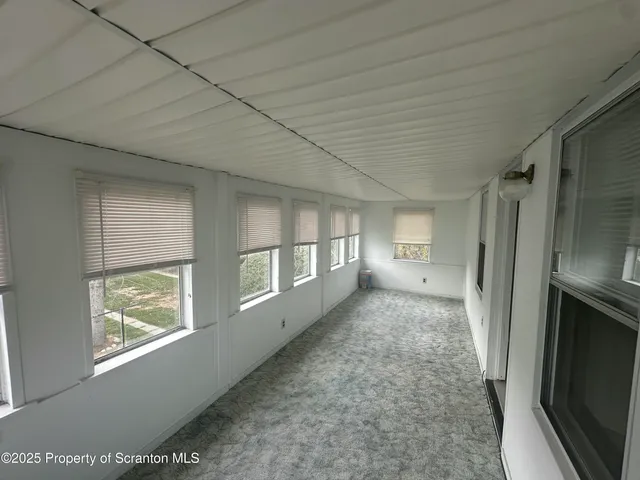 a view of empty room with windows