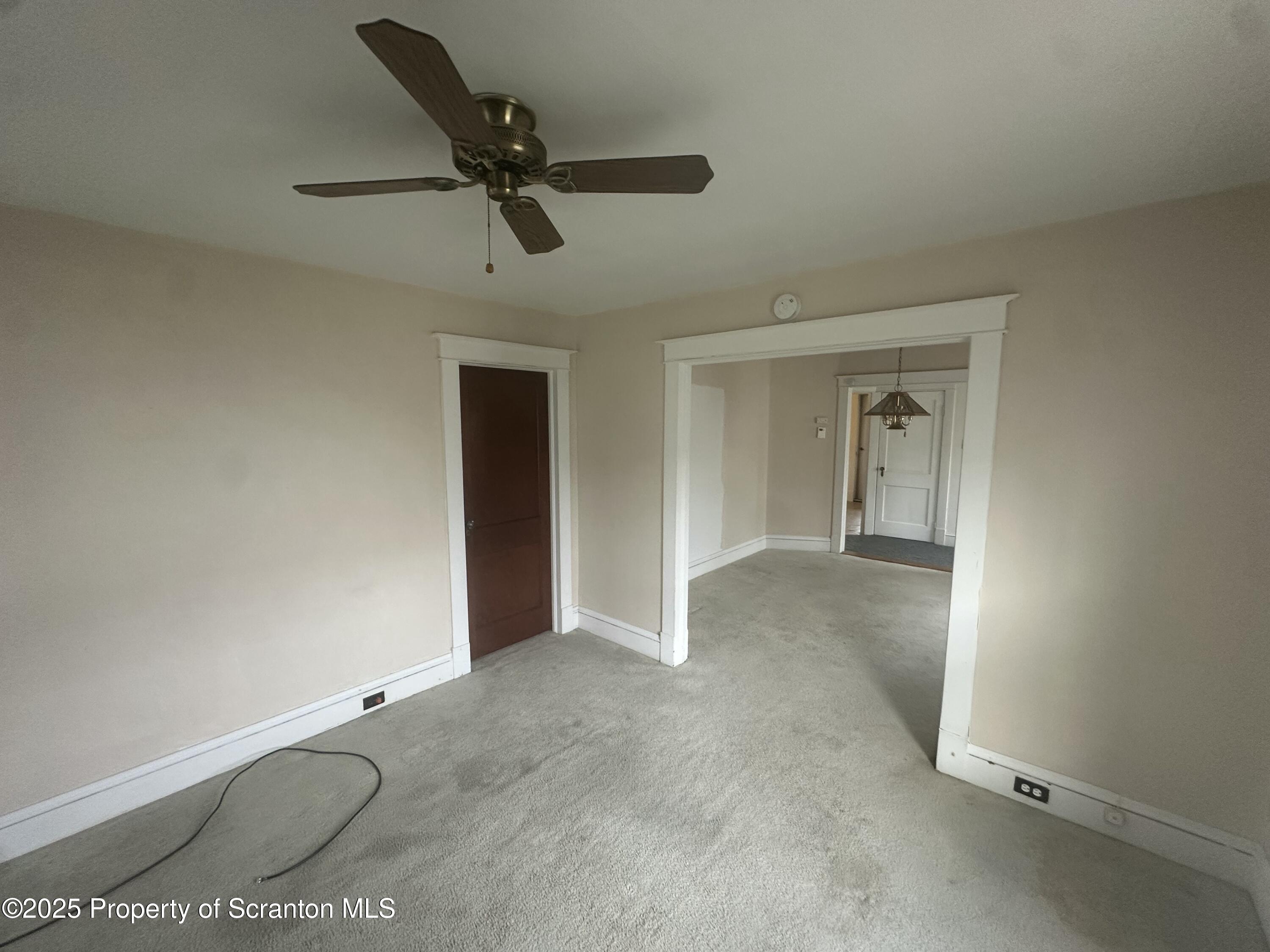1906 Farr Street, Unit 2 Scranton, PA 18504 - Photo 6 of 14 a view of a room with a ceiling fan and window