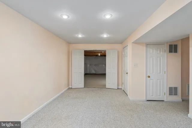 an empty room with a bathroom