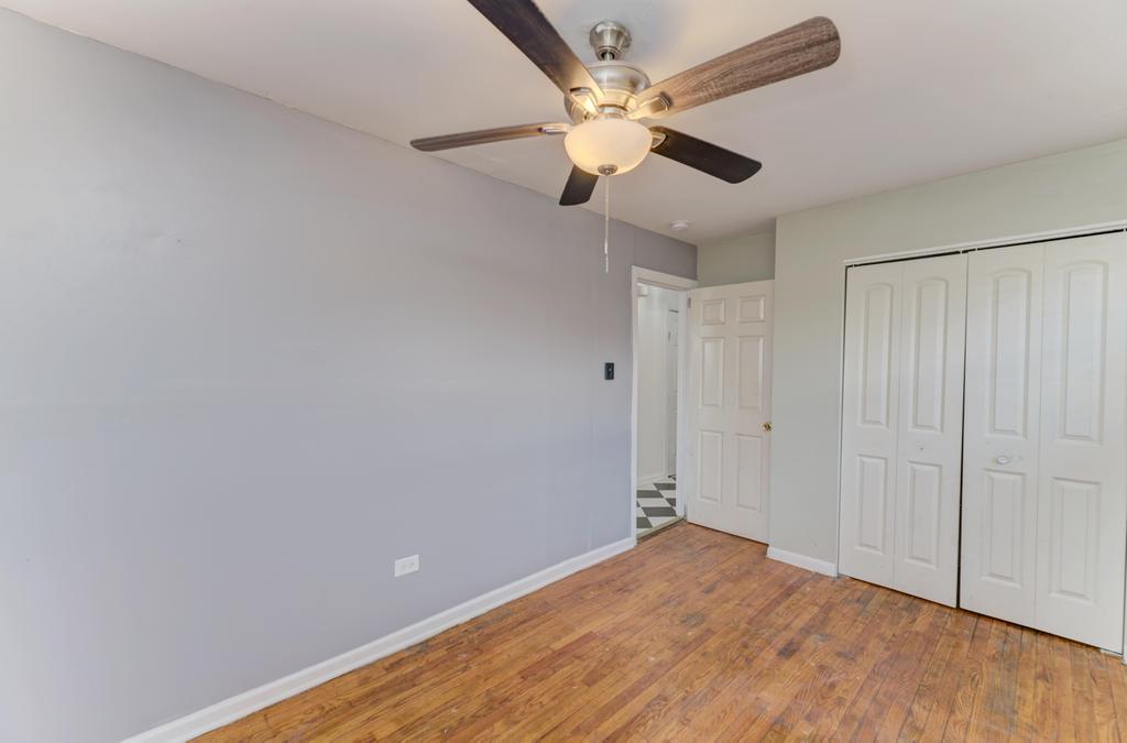 1472 West 74th Street Chicago, IL 60636 - Photo 19 of 32 wooden floor in an empty room