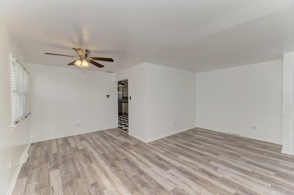 1472 West 74th Street Chicago, IL 60636 - Photo 7 of 32 a view of empty room with wooden floor