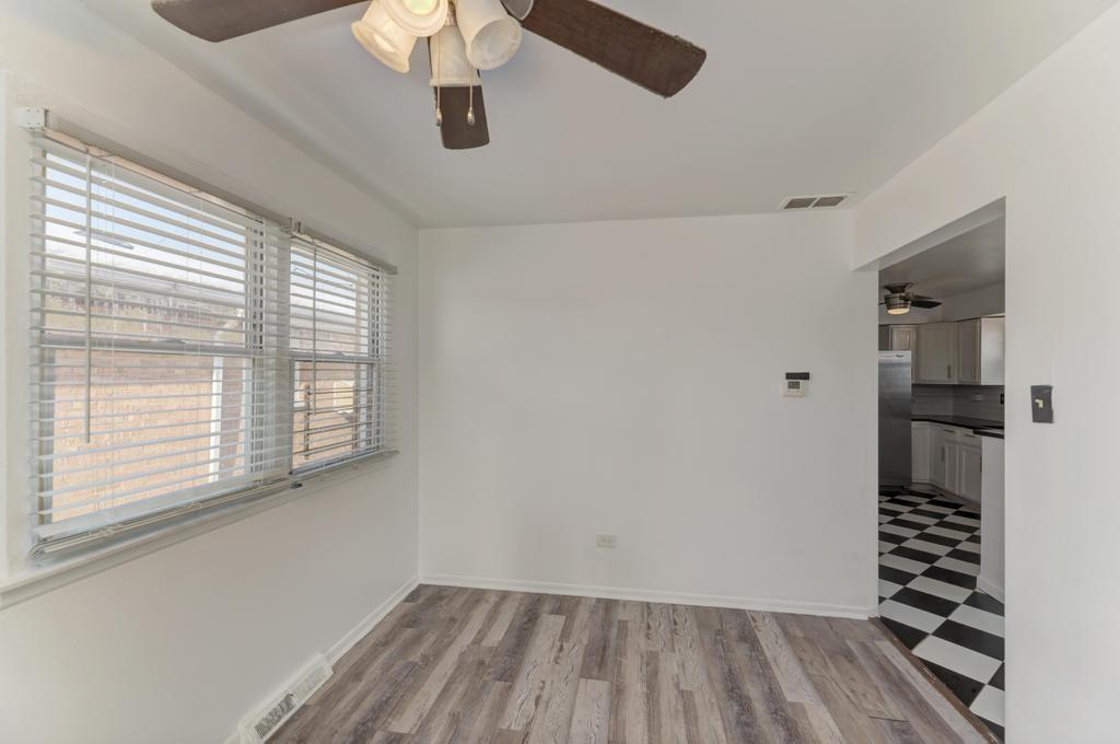 1472 West 74th Street Chicago, IL 60636 - Photo 8 of 32 a view of wooden floor and windows in a room