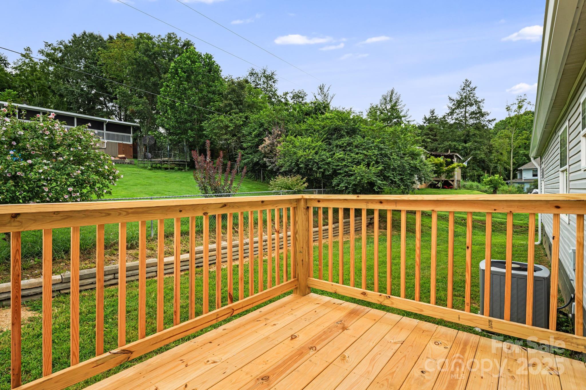 21 Toms Road Candler, NC 28715 - Photo 14 of 29 a view of a wooden balcony
