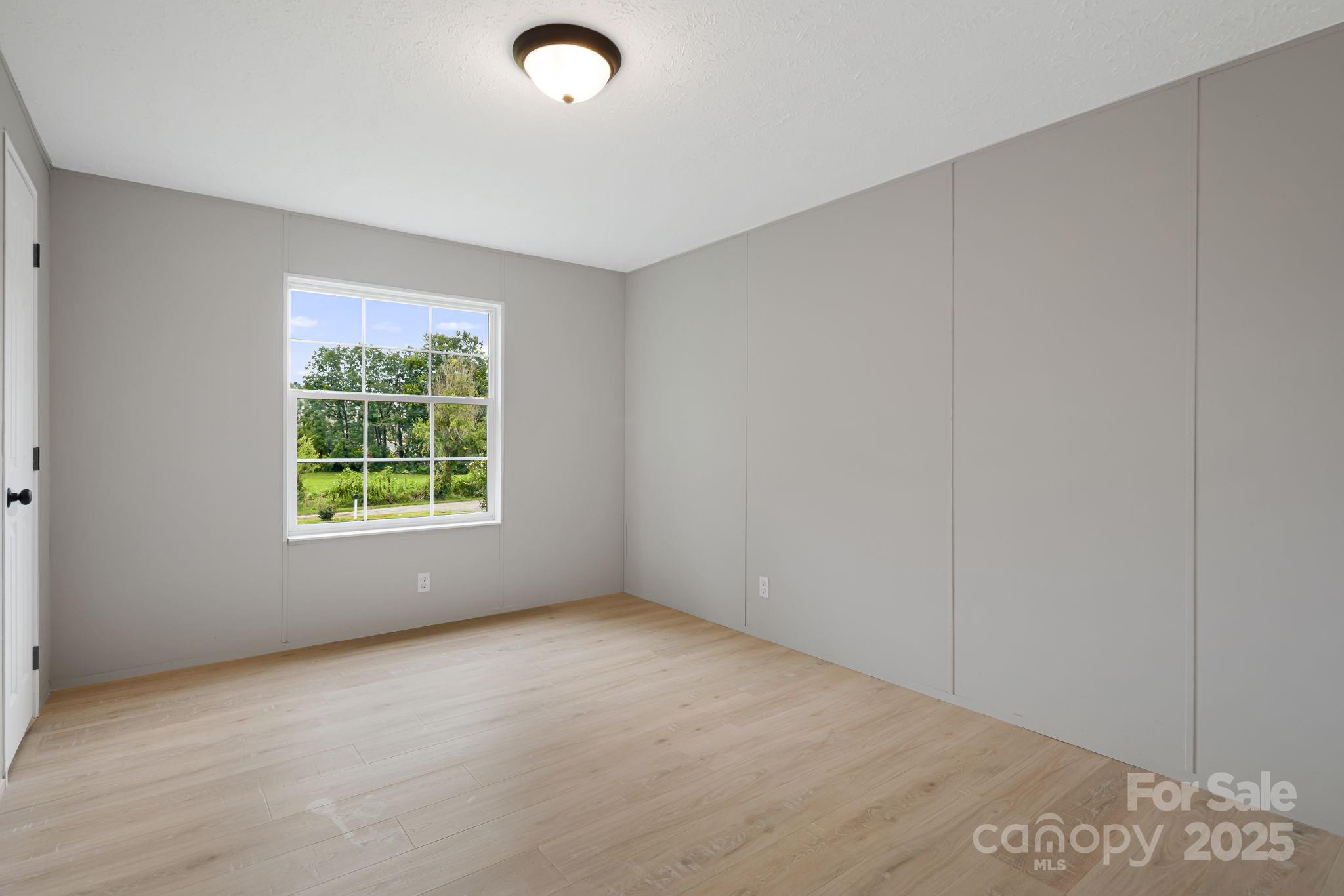 21 Toms Road Candler, NC 28715 - Photo 16 of 29 an empty room with windows