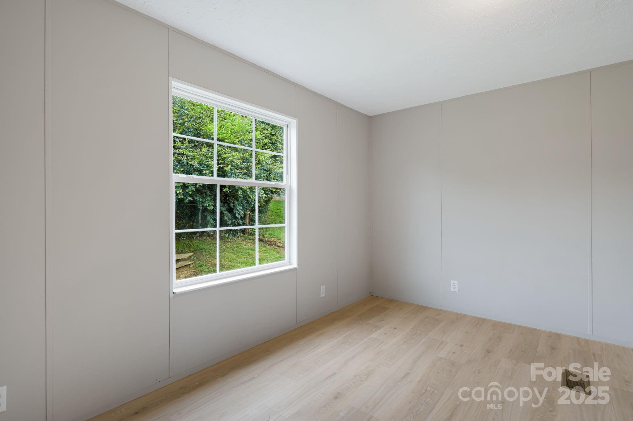 21 Toms Road Candler, NC 28715 - Photo 17 of 29 an empty room with a window