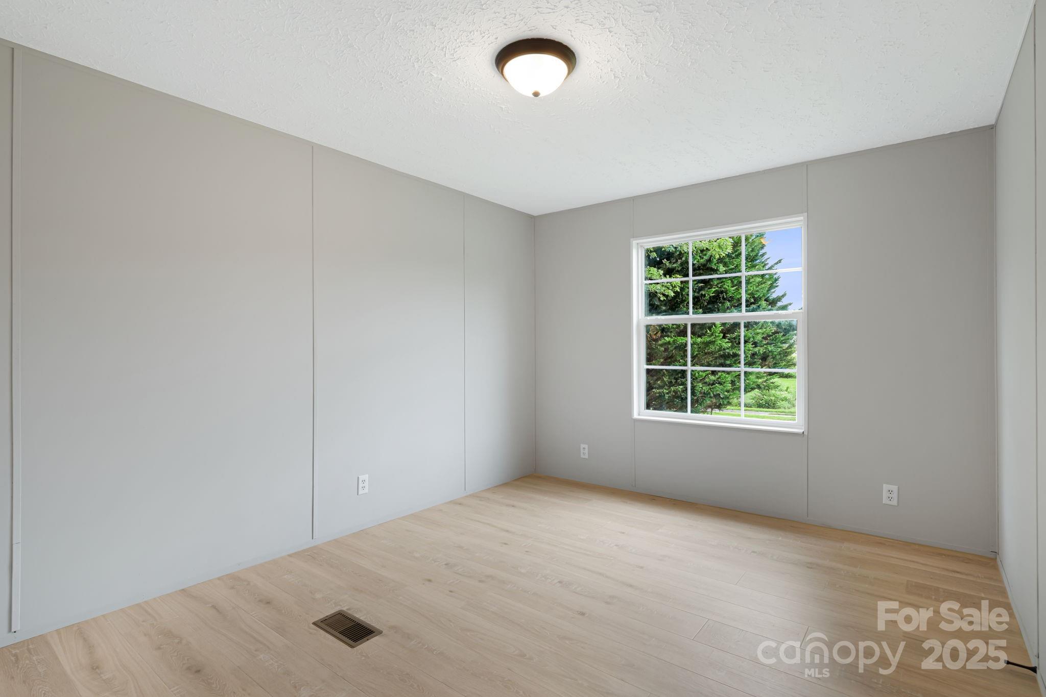 21 Toms Road Candler, NC 28715 - Photo 19 of 29 an empty room with a window