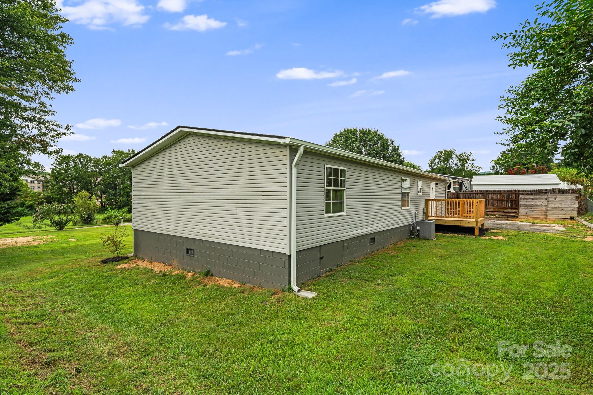 21 Toms Road Candler, NC 28715 - Photo 26 of 29 a view of a house with backyard