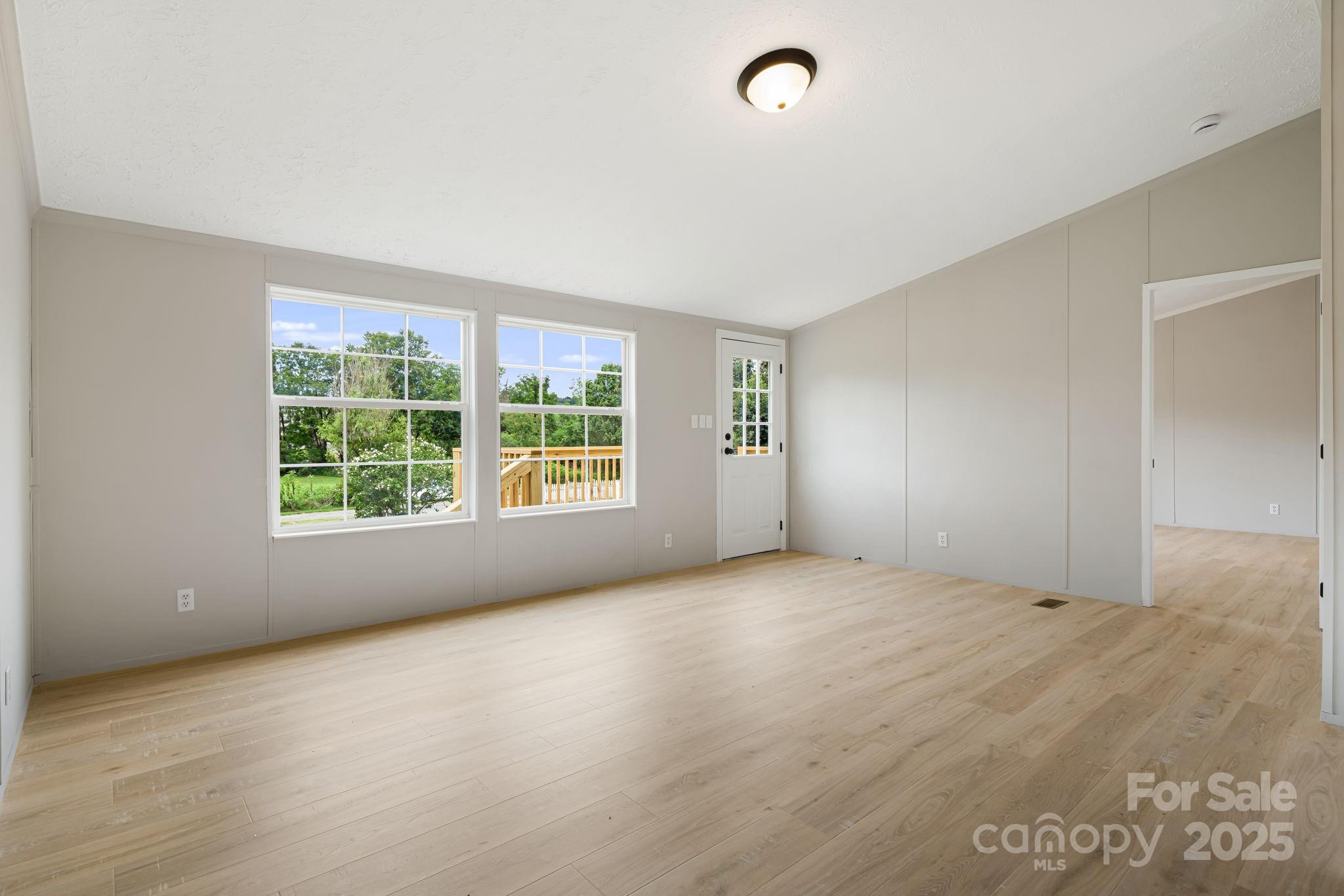 21 Toms Road Candler, NC 28715 - Photo 7 of 29 a view of an empty room with a window