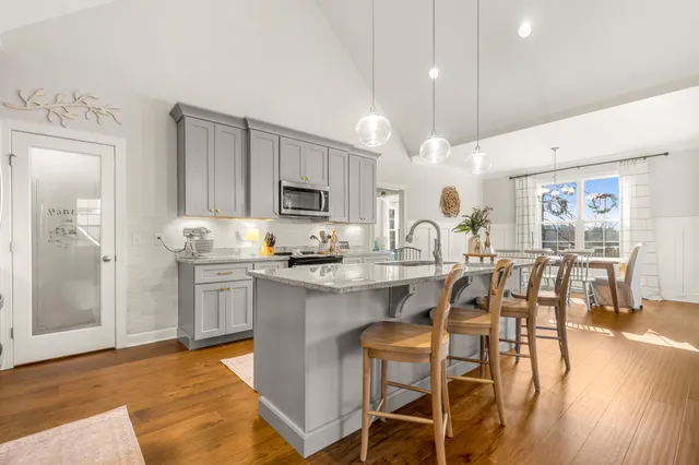a spacious bedroom with a bed and a large window