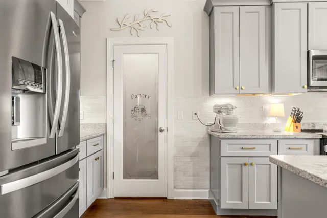 a group of people sitting in a bedroom