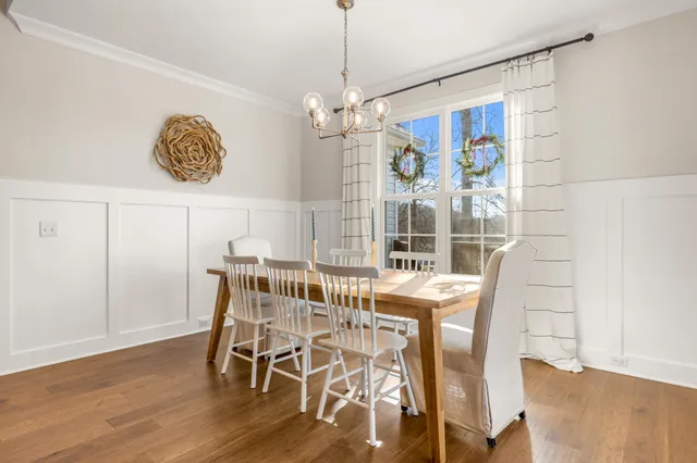a bathroom with a granite countertop toilet sink and mirror