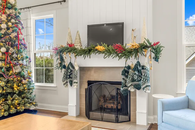 a kitchen with stainless steel appliances kitchen island granite countertop a sink dishwasher a stove top oven a refrigerator with island and chairs