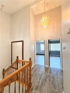 a view of an entryway with wooden floor