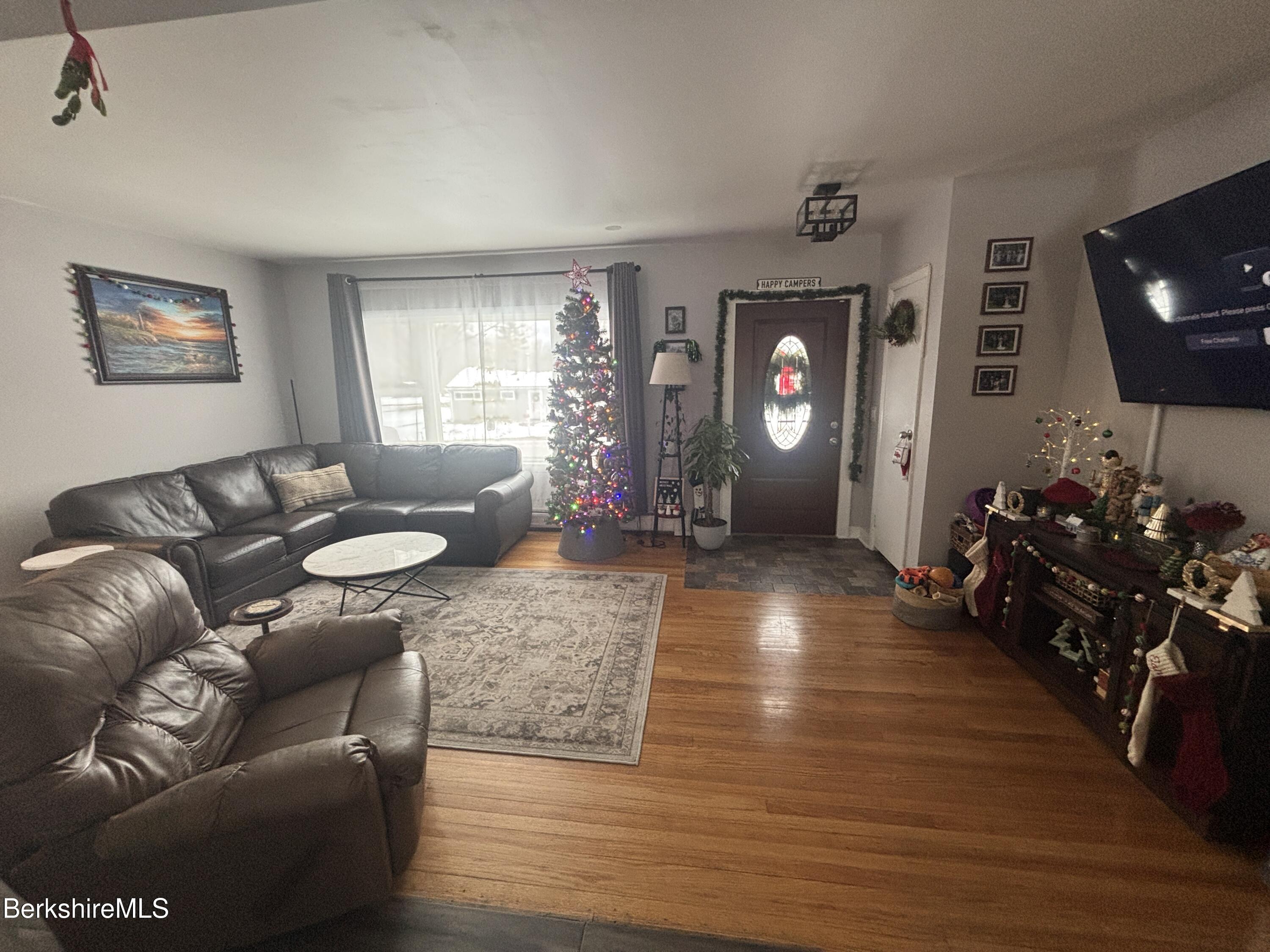 115 Luce Road Williamstown, MA 01267 - Photo 6 of 20 a living room with furniture and a flat screen tv