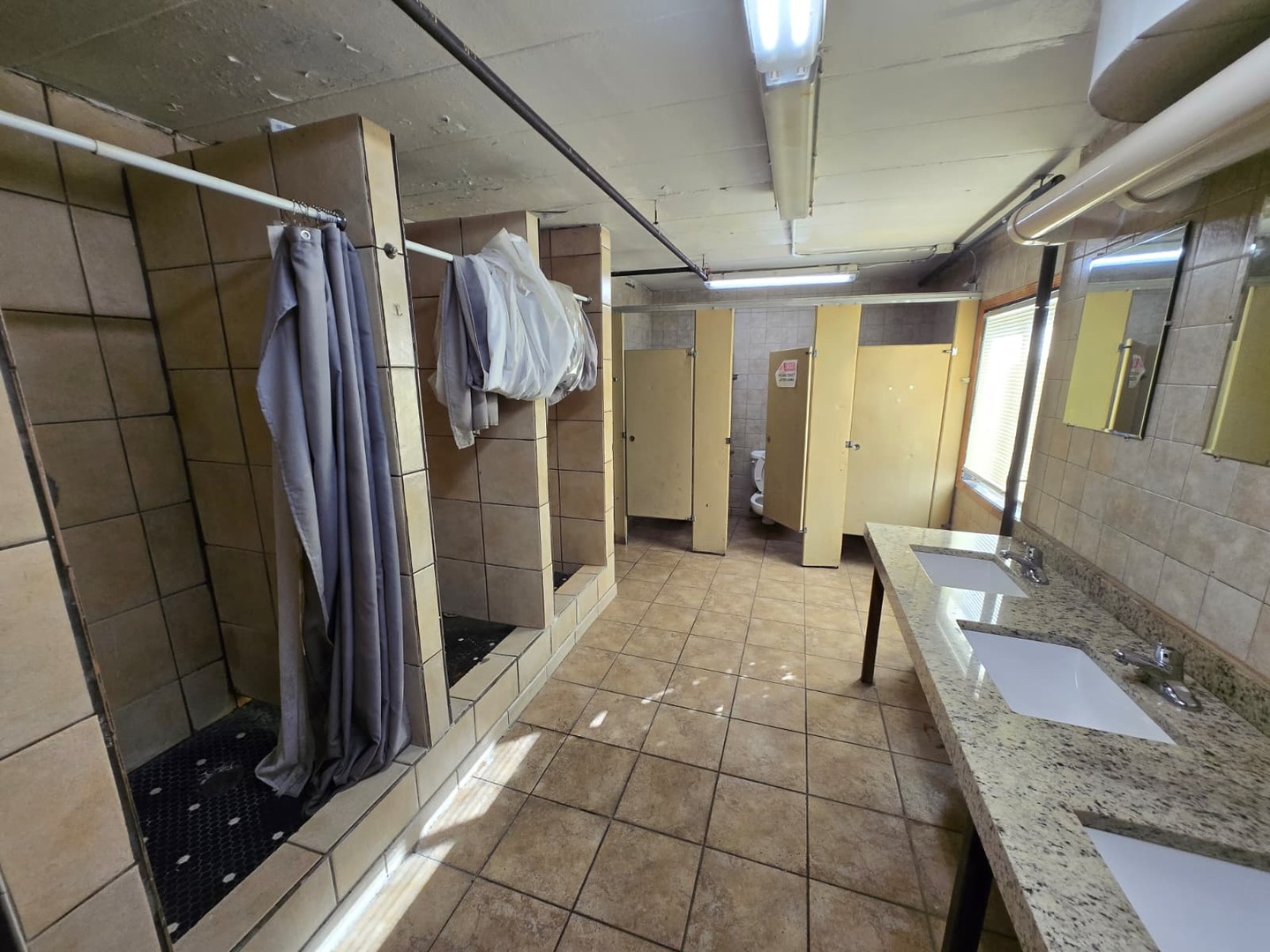 924 Greenbrier Road DeKalb, IL 60115 - Photo 14 of 20 a bathroom with a granite countertop shower and a sink