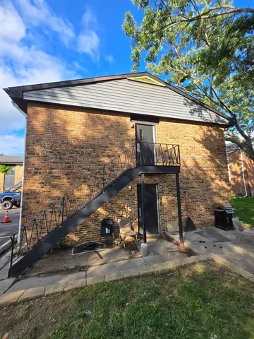 a view of backyard with barbeque grill and a fountain