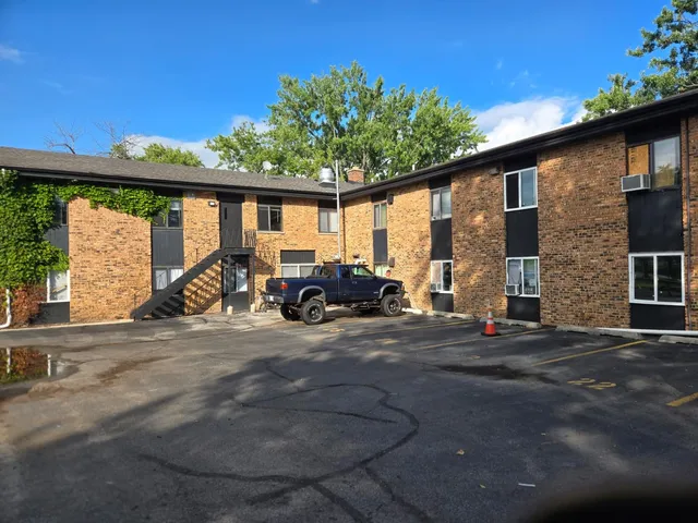 a storage and utility room with two washing machine