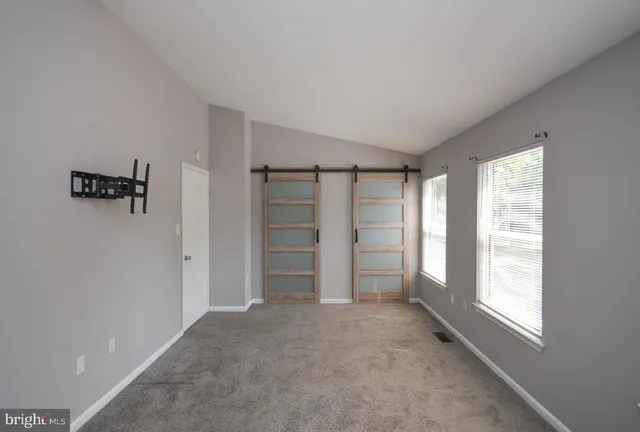 a view of empty room with closet area