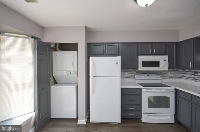 a kitchen with a refrigerator stove and microwave