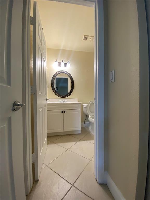 5701 Riverside Drive, Unit 302 Coral Springs, FL 33067 - Photo 13 of 21 a bathroom with a sink and a mirror