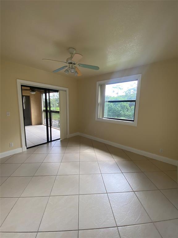 5701 Riverside Drive, Unit 302 Coral Springs, FL 33067 - Photo 15 of 21 a view of an empty room with a window
