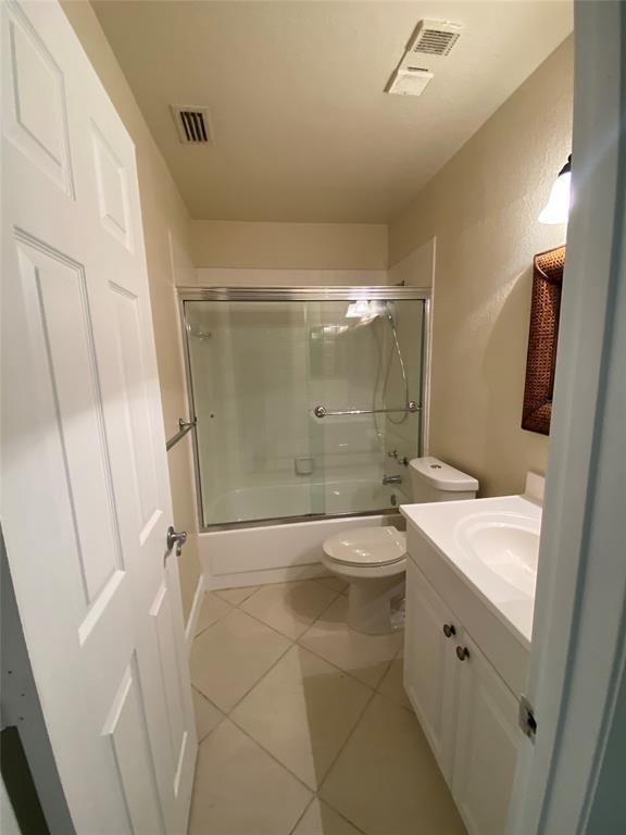 5701 Riverside Drive, Unit 302 Coral Springs, FL 33067 - Photo 17 of 21 a bathroom with a double vanity sink toilet and shower