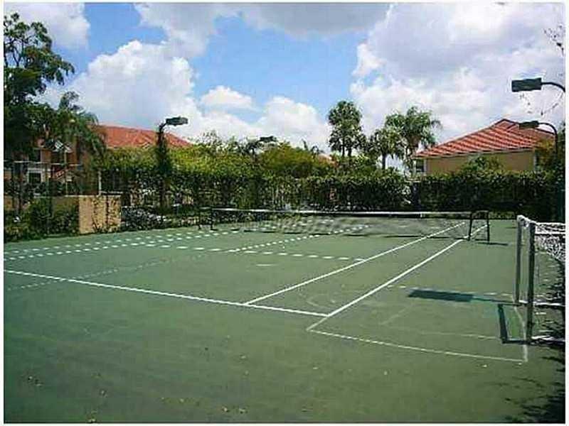 5701 Riverside Drive, Unit 302 Coral Springs, FL 33067 - Photo 21 of 21 a view of a tennis court