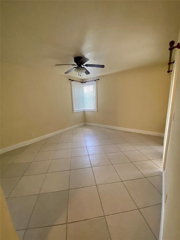 5701 Riverside Drive, Unit 302 Coral Springs, FL 33067 - Photo 9 of 21 a view of an empty room with a window