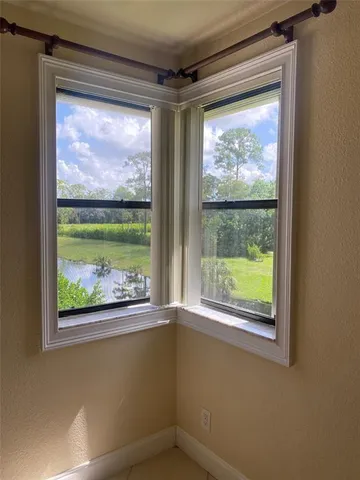 a view of a room that has a large window
