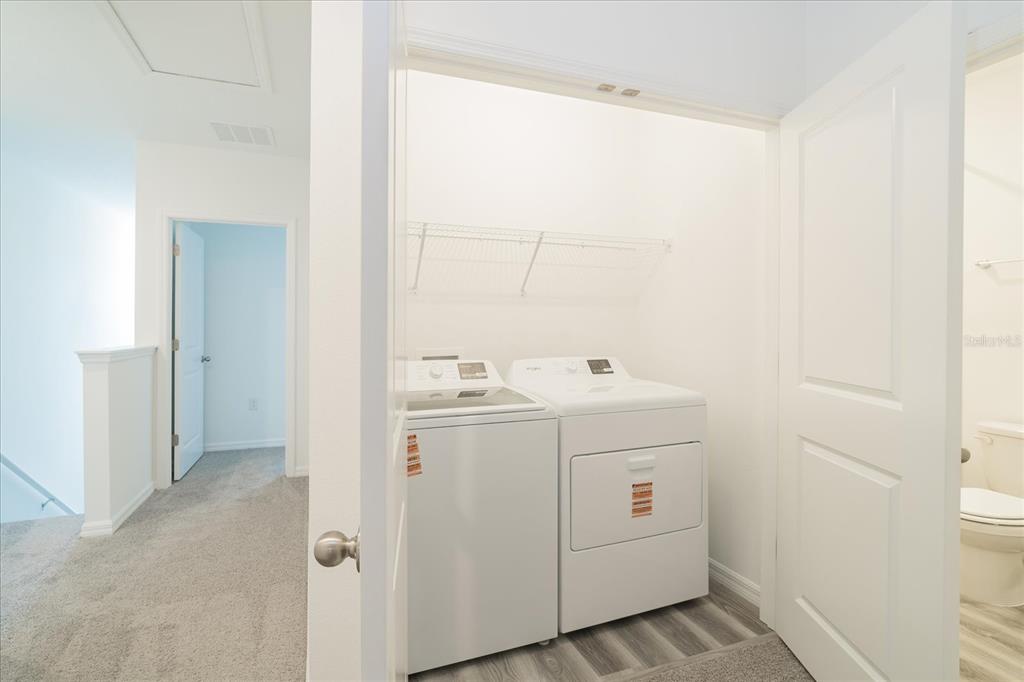 2466 Riversong Ldg Lane Wesley Chapel, FL 33543 - Photo 17 of 33 a utility room with dryer and washer