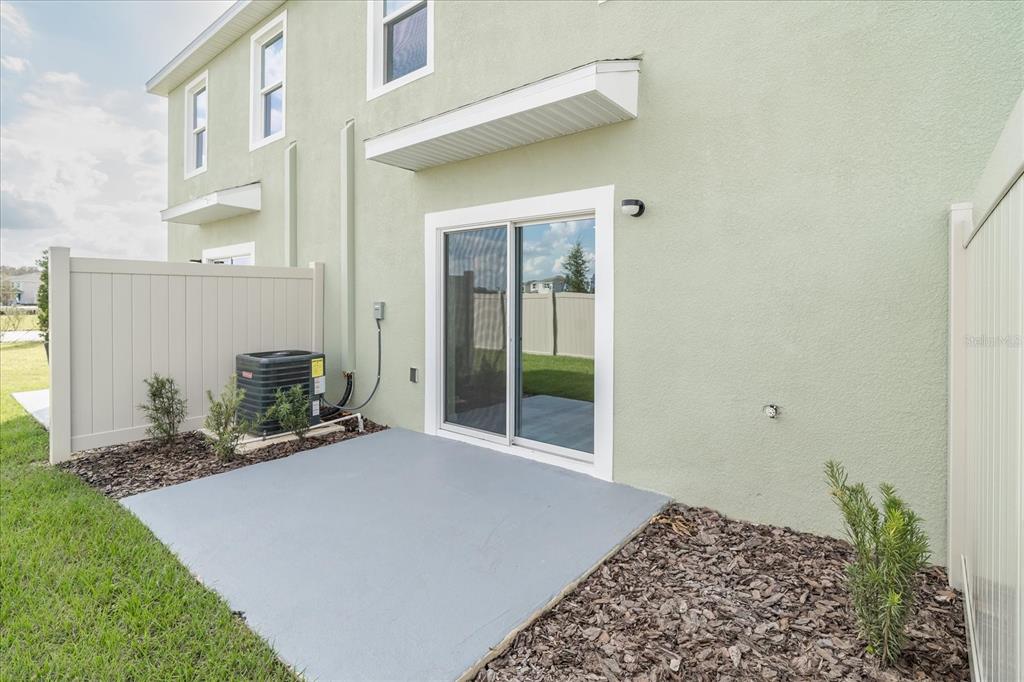 2466 Riversong Ldg Lane Wesley Chapel, FL 33543 - Photo 23 of 33 a view of a backyard of a house