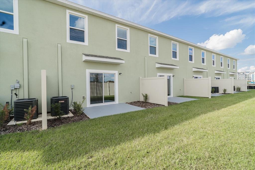 2466 Riversong Ldg Lane Wesley Chapel, FL 33543 - Photo 24 of 33 a view of an house with backyard and porch