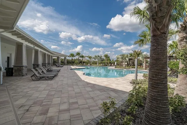a view of swimming pool from a lake view