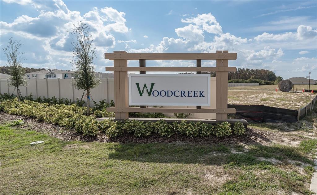 2466 Riversong Ldg Lane Wesley Chapel, FL 33543 - Photo 32 of 33 a sign on the side of a building