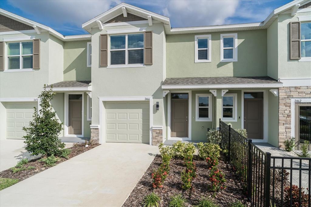 2466 Riversong Ldg Lane Wesley Chapel, FL 33543 - Photo 33 of 33 a front view of a house with a garden