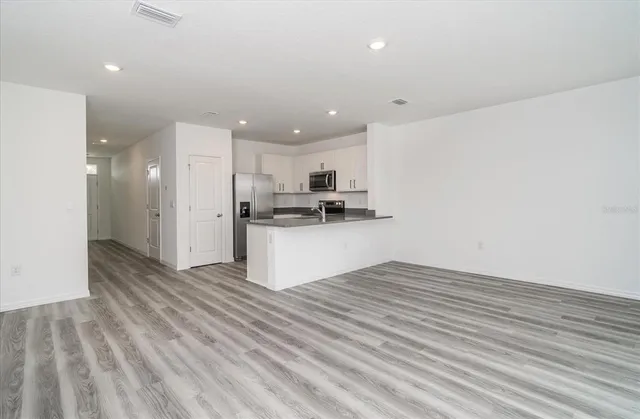 a view of kitchen kitchen microwave and cabinets