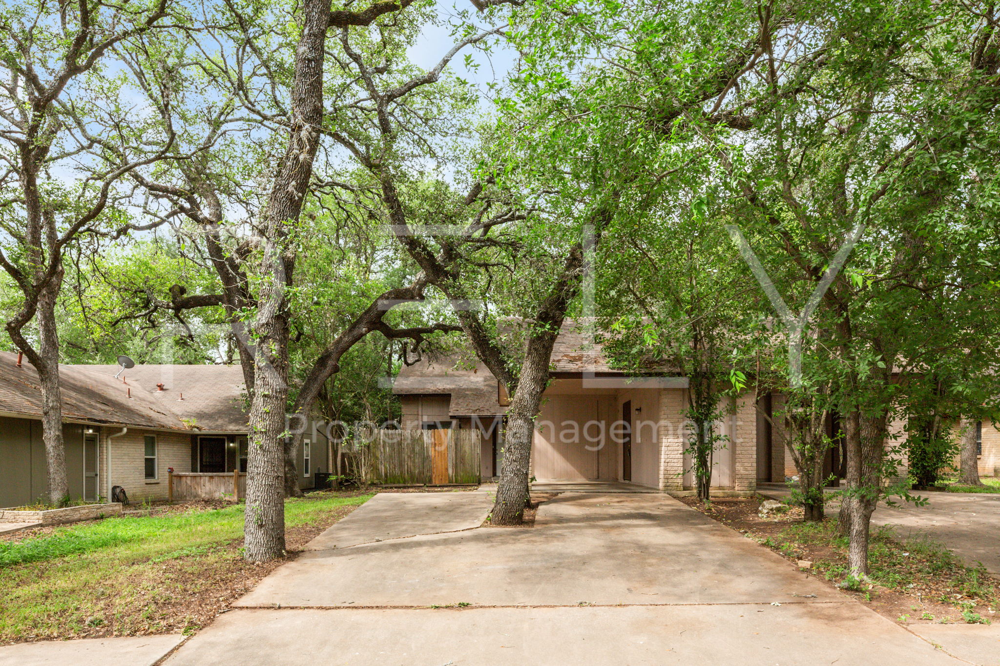 1005 Milford Way, Unit A Austin, TX 78745 - Photo 3 of 30 a view of a house with street that has a tree