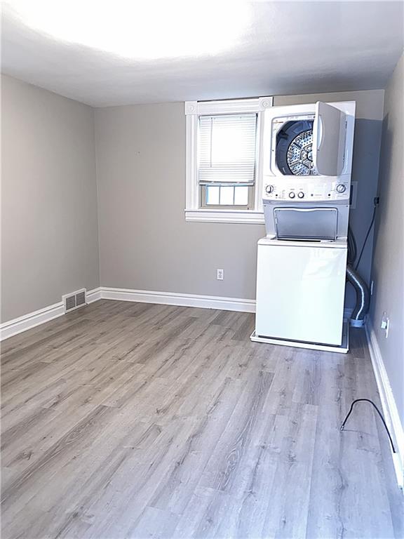259 Mercer Street Harmony, PA 16037 - Photo 11 of 19 an empty room with wooden floor and window