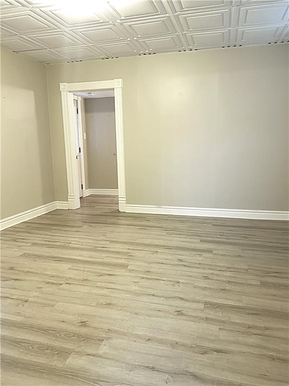 259 Mercer Street Harmony, PA 16037 - Photo 12 of 19 a view of an empty room with wooden floor