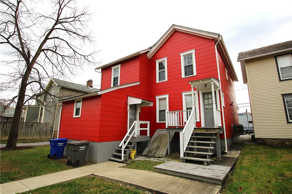 259 Mercer Street Harmony, PA 16037 - Photo 13 of 19 a front view of a house with garden