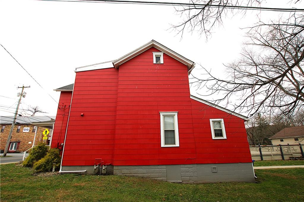 259 Mercer Street Harmony, PA 16037 - Photo 3 of 19 a front view of a house with a yard