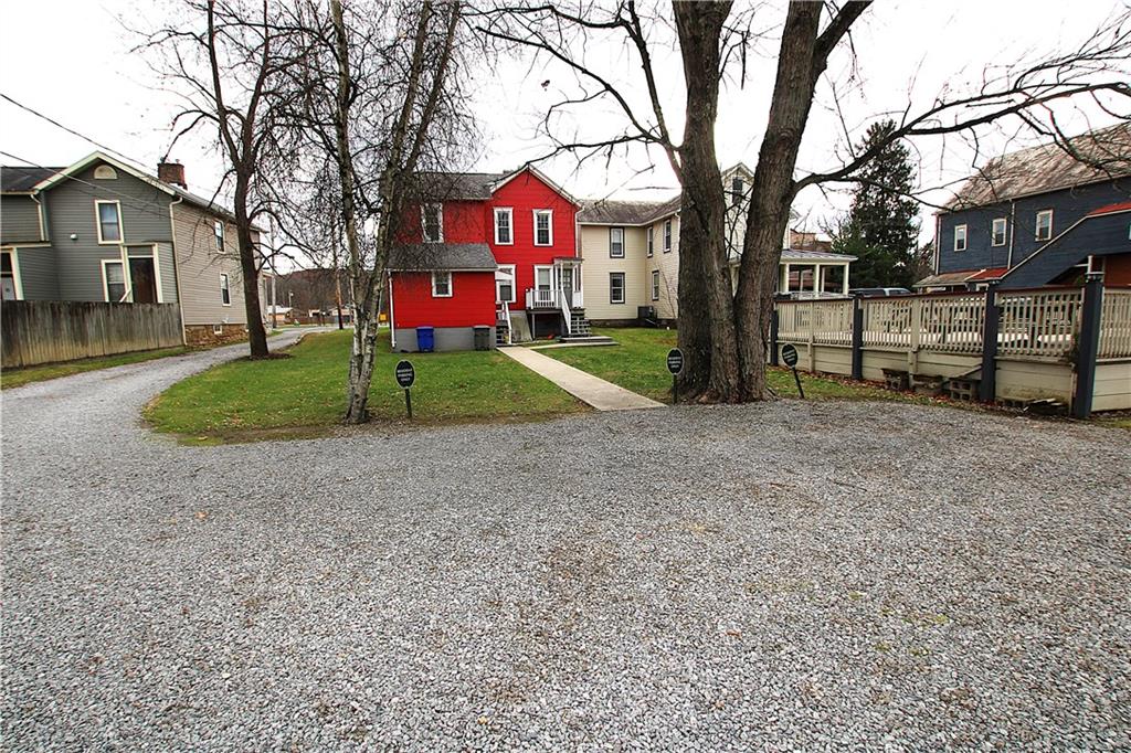 259 Mercer Street Harmony, PA 16037 - Photo 4 of 19 a view of a house with a yard and large tree